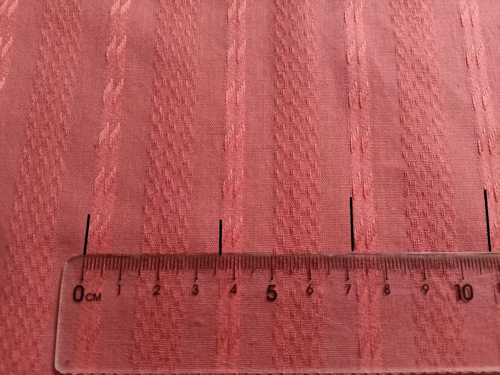Marked 3.6 cm warp repeat length on jacquard fabric