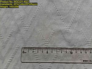 WGCGY-4021 allover jacquard chevron openwork, large-scale jacquard V-shaped openwork texture. Structure is color-agnostic (sample displayed in white). Structure-based matching; scale invariant ratio [8:9:8:9:8:8:8:9:8:9]. Available in all Pantone colors. Applicable to jacquard chevron fabrics, openwork jacquard textiles, large pattern woven fabrics.